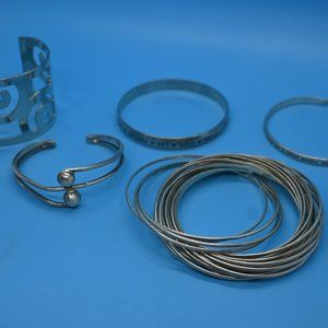 Lot of 5 silver and SS bracelets.